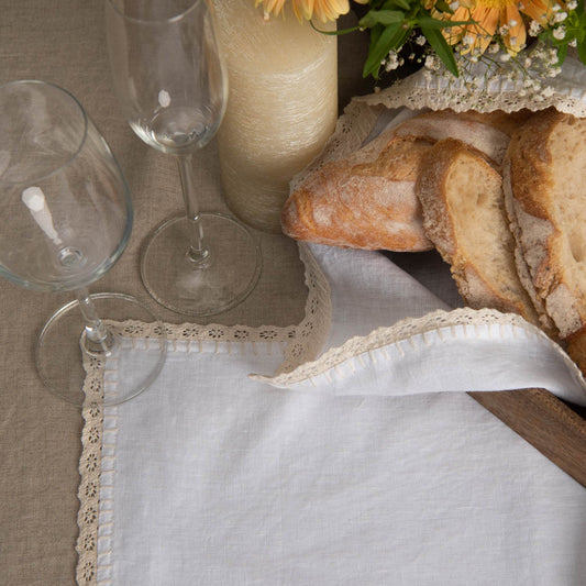 Lace edged white linen table mats