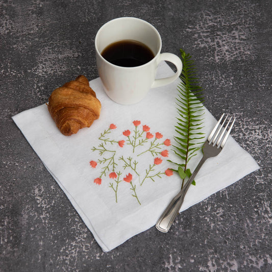 Embroidered white linen napkins