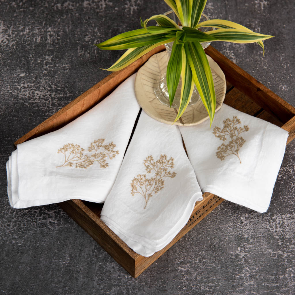 Embroidered white linen dinner napkins