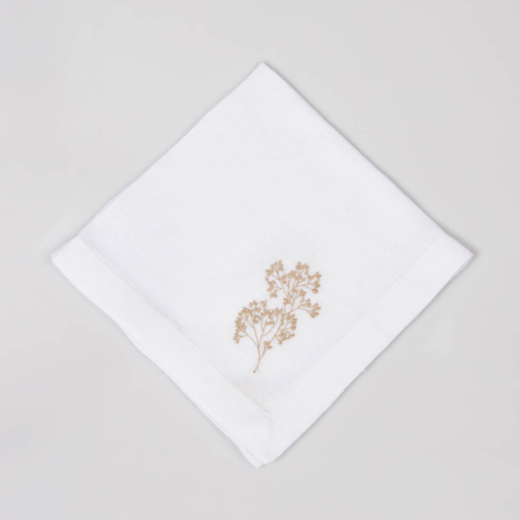 Embroidered white linen dinner napkins