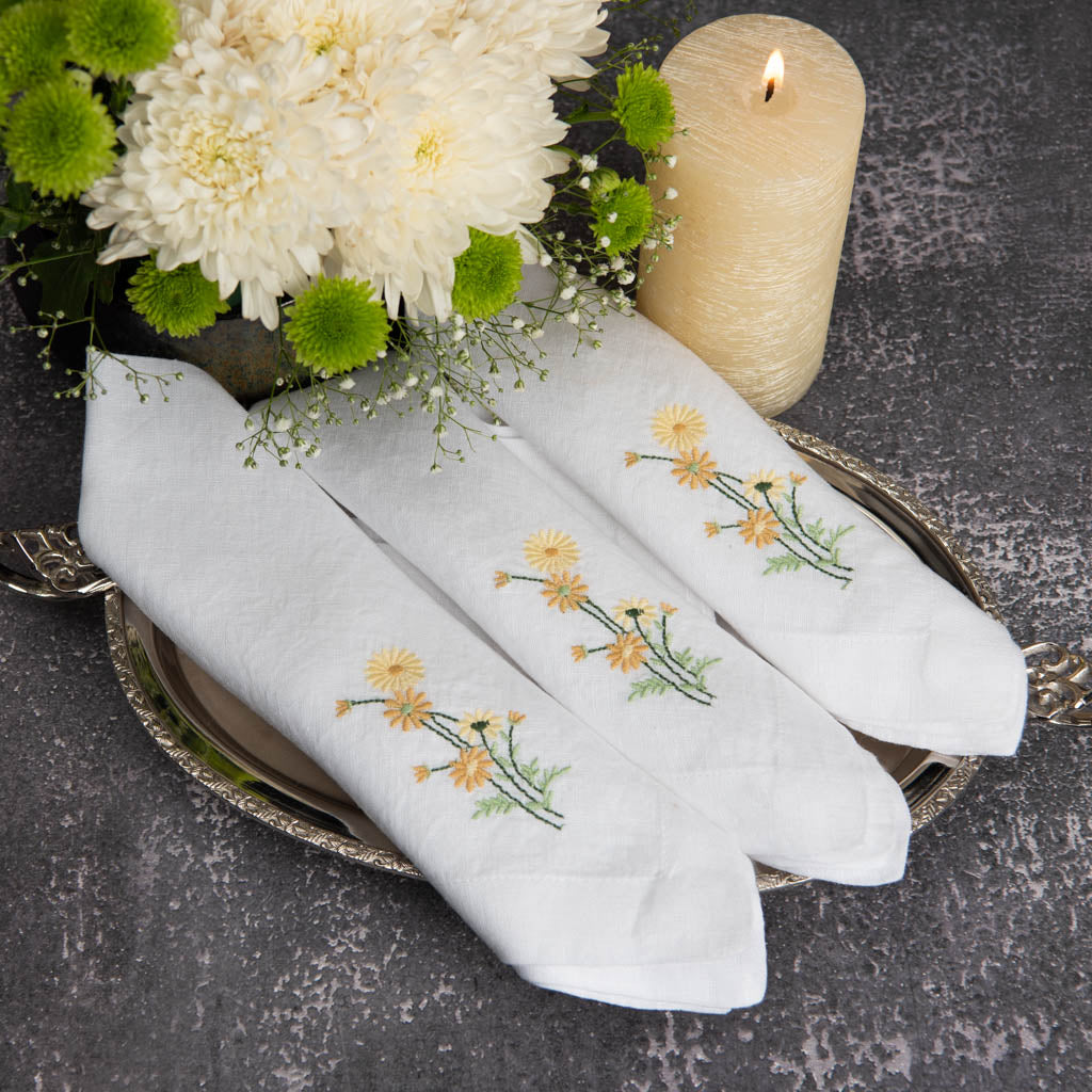 Embroidered white linen napkins