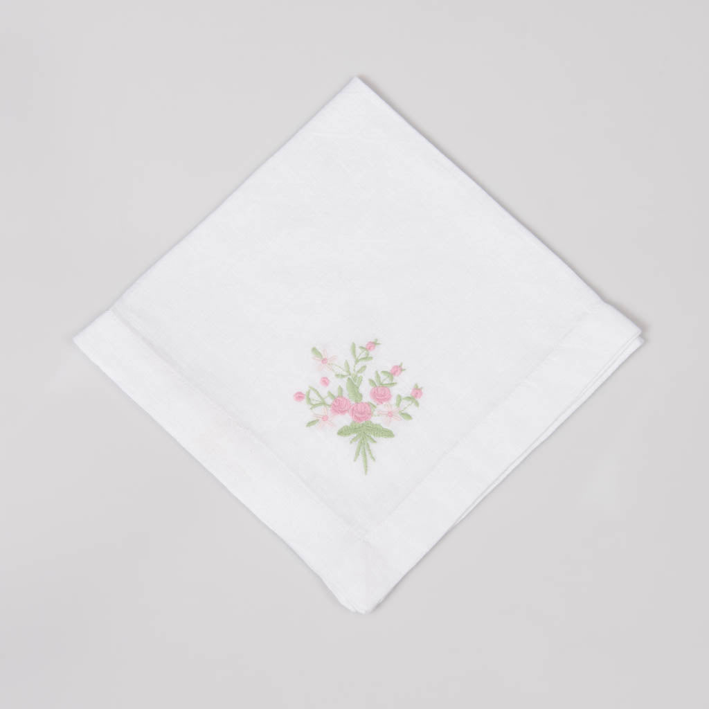 Embroidered white linen dinner napkins