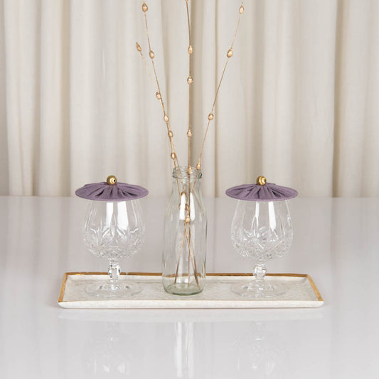 Glass covers in amethyst smoke linen with gold bead handle