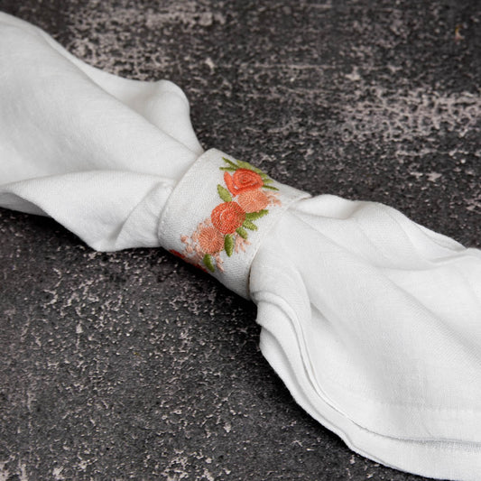 Embroidered white linen napkin rings